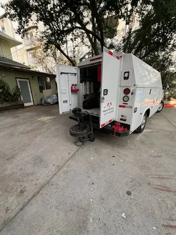 Magnet Plumbing service vehicle on-site for Grease Trap Cleaning in Hi-Nella